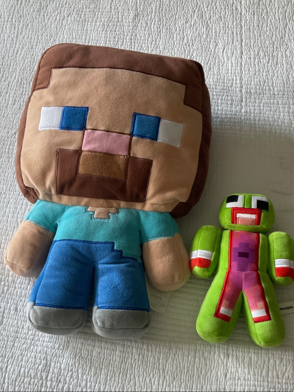 Minecraft Steve and YouTuber Unspeakable's green avatar plushies